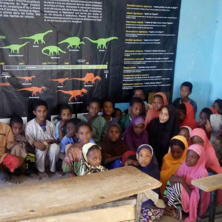 Marandet school children with educational poster
